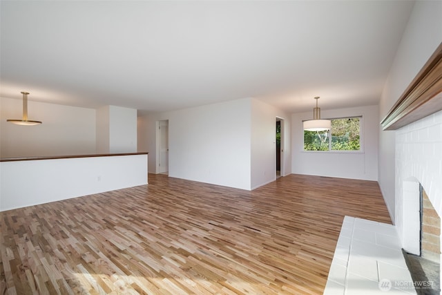 unfurnished living room featuring light wood-style floors