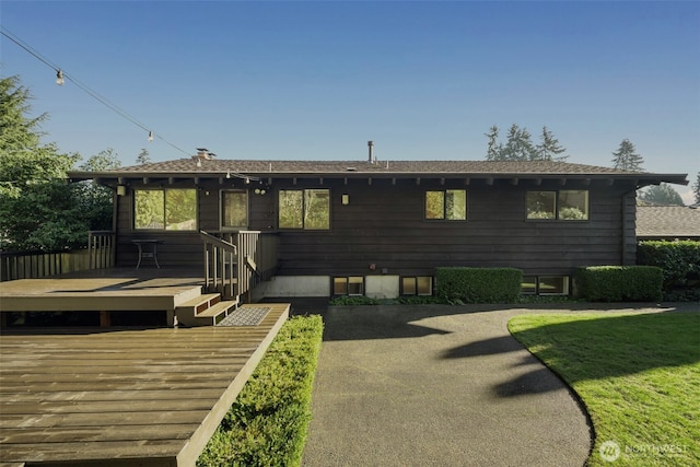 back of property with a deck