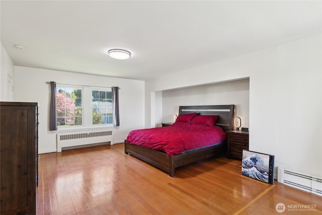 301 S 6th St, Mount Vernon, WA 98274 - bedroom with radiator, baseboard heating, and hardwood / wood-style floors