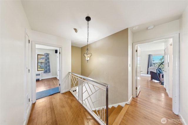 301 S 6th St, Mount Vernon, WA 98274 - hall with an upstairs landing, radiator heating unit, light wood finished floors, and baseboards