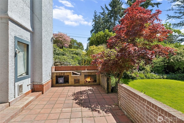 301 S 6th St, Mount Vernon, WA 98274 - view of patio with a lit fireplace