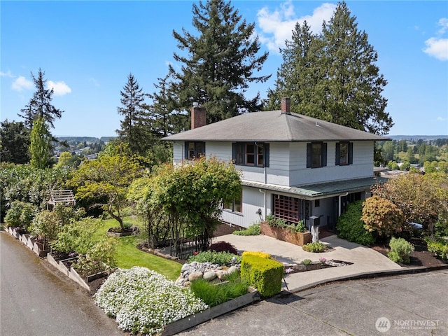 301 S 6th St, Mount Vernon, WA 98274 - view of front of house featuring a chimney and a vegetable garden