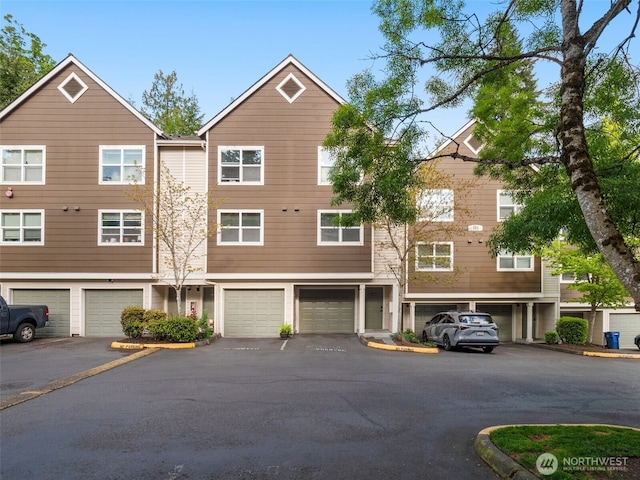 3116 164th St SW Unit 1804, Lynnwood, WA 98087 - view of property featuring driveway and an attached garage