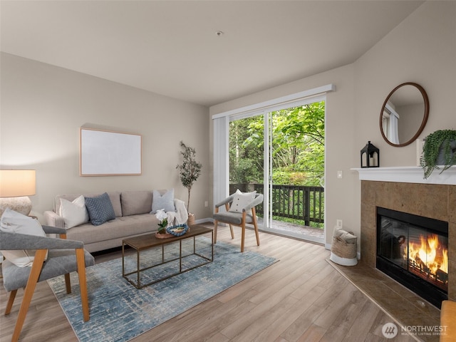 3116 164th St SW Unit 1804, Lynnwood, WA 98087 - living room featuring wood finished floors and a tiled fireplace