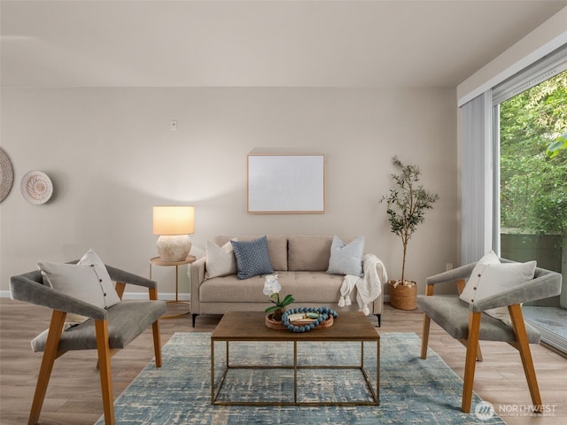 3116 164th St SW Unit 1804, Lynnwood, WA 98087 - living room with wood finished floors and baseboards