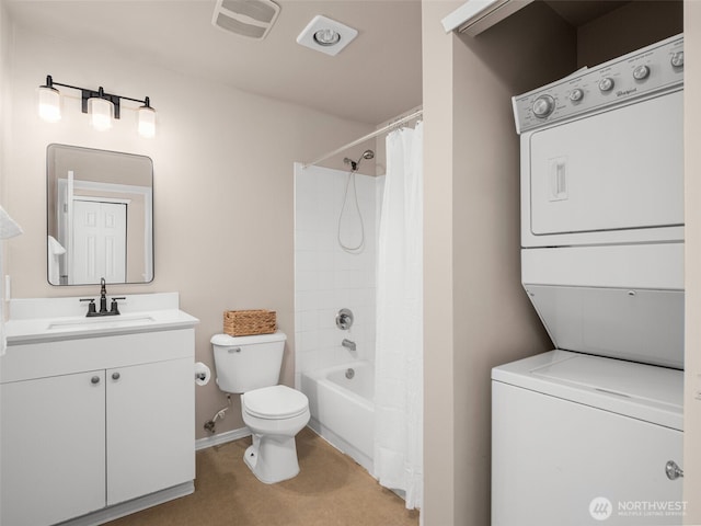 3116 164th St SW Unit 1804, Lynnwood, WA 98087 - bathroom featuring stacked washer and clothes dryer, toilet, vanity, shower / bath combo, and baseboards
