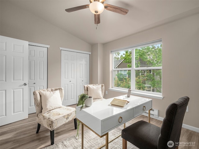 3116 164th St SW Unit 1804, Lynnwood, WA 98087 - home office with vaulted ceiling, ceiling fan, light wood-style floors, a baseboard heating unit, and baseboards