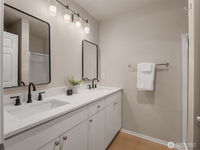 3116 164th St SW Unit 1804, Lynnwood, WA 98087 - full bath featuring baseboards, double vanity, and an enclosed shower