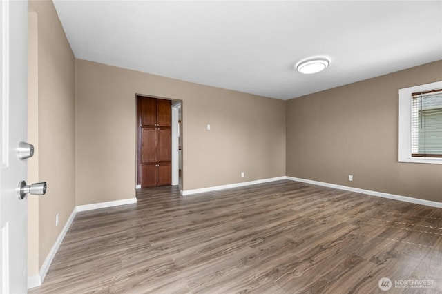 807 S Howard St, Tacoma, WA 98465 - empty room with wood finished floors and baseboards