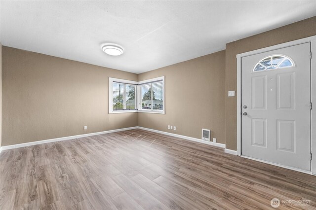 807 S Howard St, Tacoma, WA 98465 - foyer featuring wood finished floors and baseboards