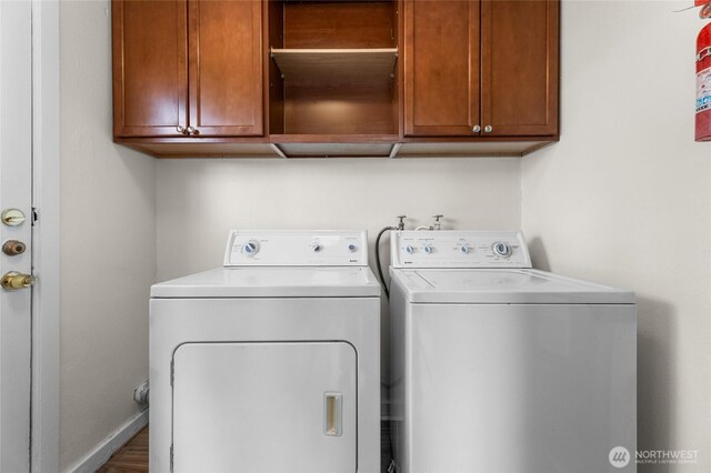 807 S Howard St, Tacoma, WA 98465 - laundry room featuring washing machine and clothes dryer and cabinet space