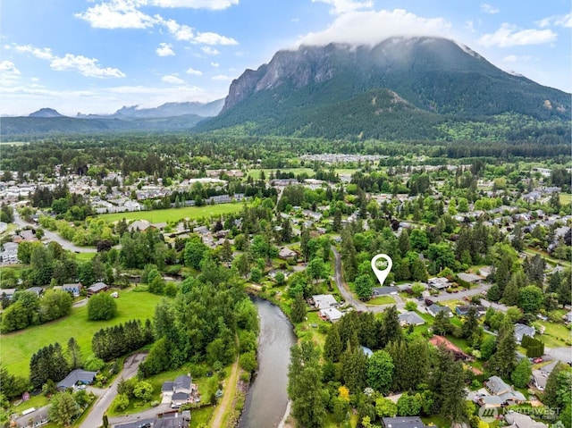 436 SE Maple Dr, North Bend, WA 98045 - aerial perspective of suburban area with a mountain backdrop
