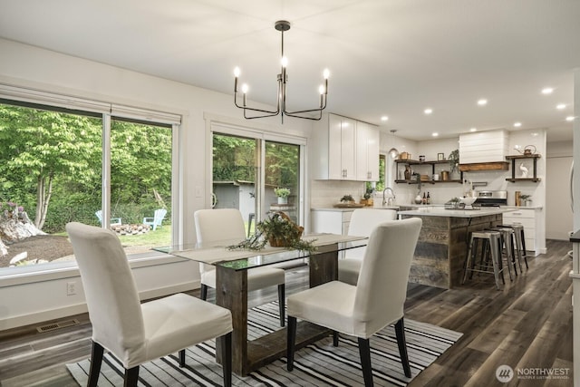 436 SE Maple Dr, North Bend, WA 98045 - dining space featuring healthy amount of natural light, a chandelier, dark wood-style floors, recessed lighting, and baseboards