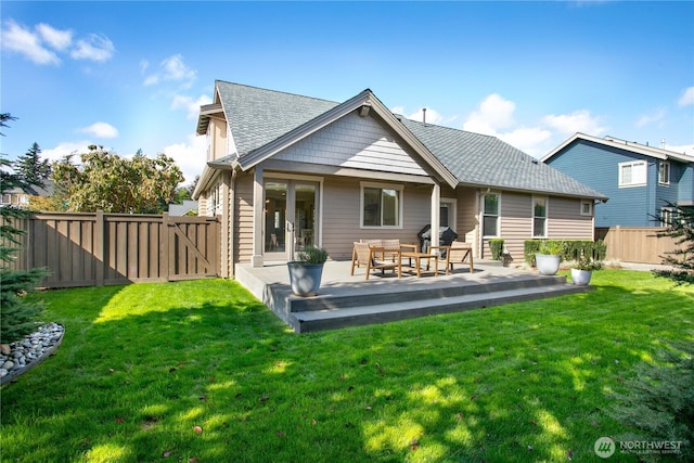 back of property featuring french doors, a shingled roof, and an outdoor hangout area
