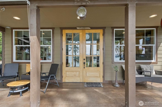 doorway to property with french doors and a porch
