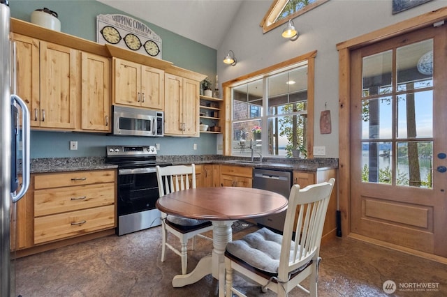 kitchen with stainless steel appliances, light brown cabinets, vaulted ceiling, a sink, and open shelves