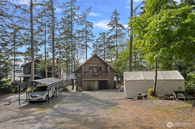 view of front of house featuring a detached carport and driveway