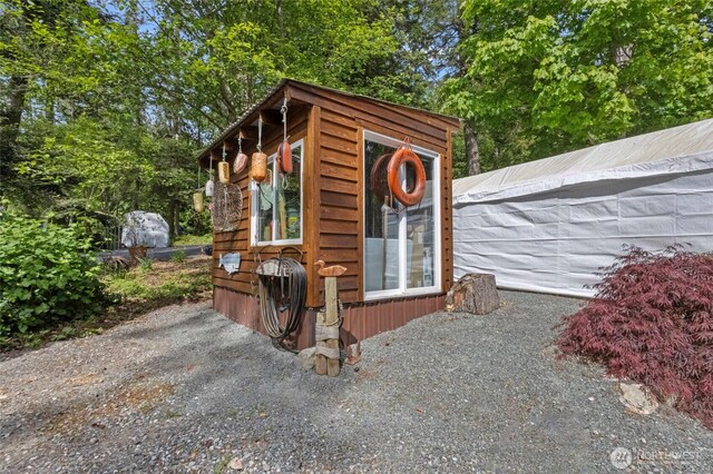 view of outbuilding featuring an outdoor structure