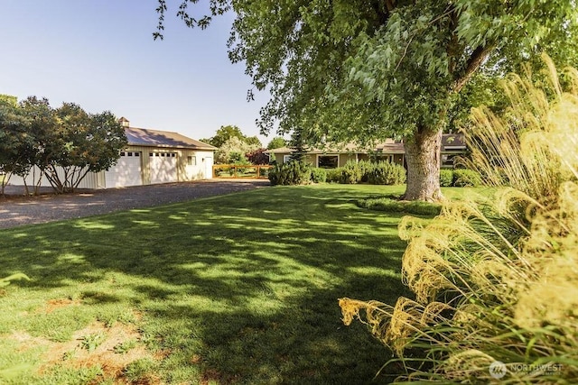 189 Hill Rd, Walla Walla, WA 99362 - view of green lawn with a detached garage