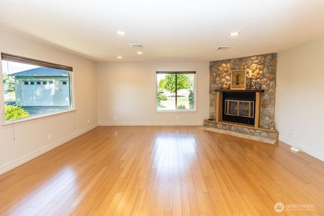 189 Hill Rd, Walla Walla, WA 99362 - unfurnished living room with light wood finished floors, a fireplace, baseboards, and recessed lighting