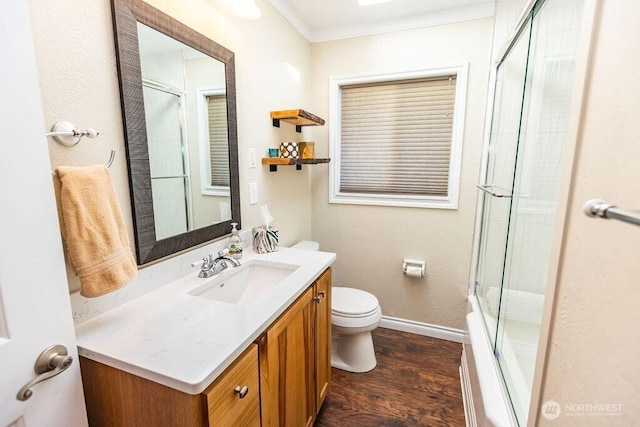 189 Hill Rd, Walla Walla, WA 99362 - bathroom with toilet, wood finished floors, vanity, baseboards, and ornamental molding