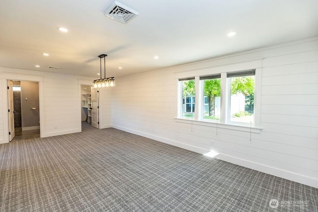189 Hill Rd, Walla Walla, WA 99362 - carpeted empty room featuring recessed lighting, wooden walls, and baseboards