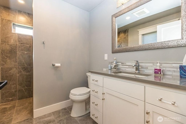 189 Hill Rd, Walla Walla, WA 99362 - bathroom featuring baseboards, vanity, walk in shower, toilet, and recessed lighting