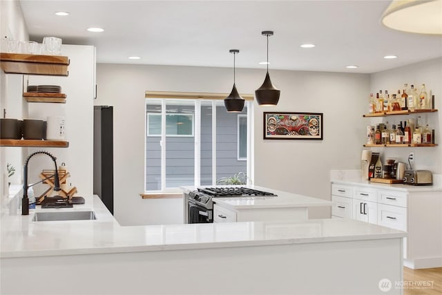 indoor bar with stainless steel range with gas stovetop, recessed lighting, and pendant lighting
