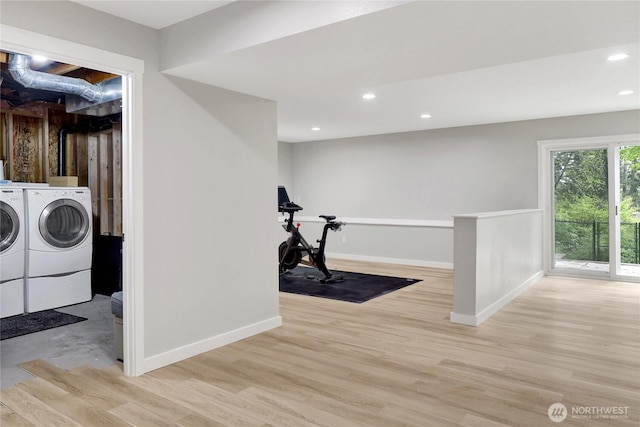 clothes washing area with separate washer and dryer, baseboards, wood finished floors, and recessed lighting