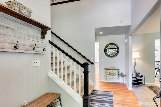 20121 3rd Ave NW, Arlington, WA 98223 - stairs with a towering ceiling, wood finished floors, and baseboards