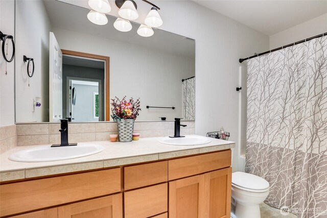 20121 3rd Ave NW, Arlington, WA 98223 - bathroom with toilet, double vanity, decorative backsplash, and shower / bathtub combination with curtain
