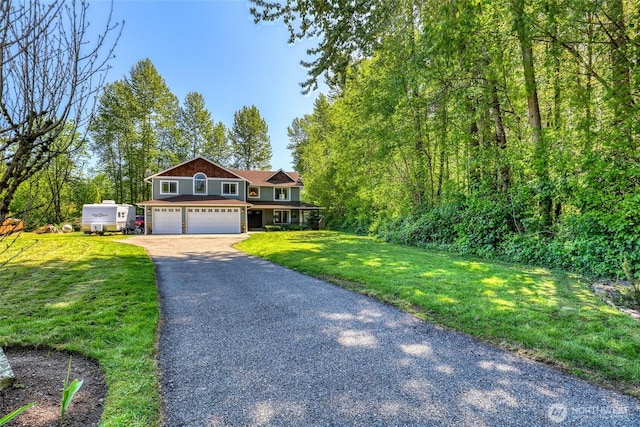 20121 3rd Ave NW, Arlington, WA 98223 - view of front of property featuring driveway, an attached garage, and a front yard