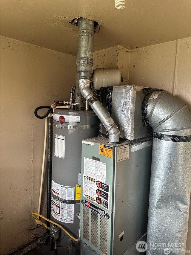 utility room featuring gas water heater