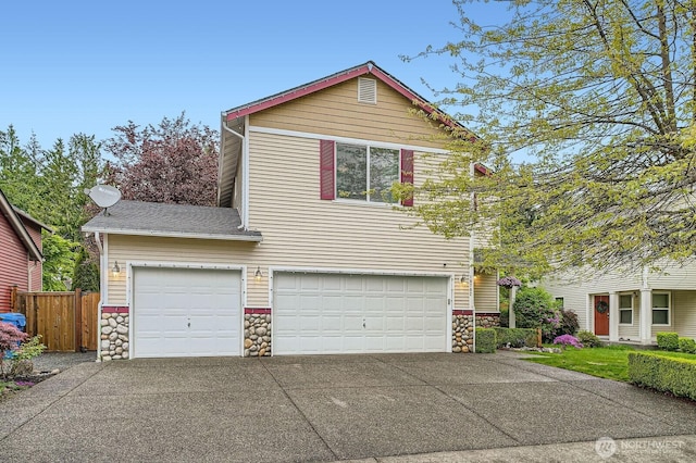 19702 99th Ct E, Bonney Lake, WA 98391 - view of front of house with stone siding, driveway, and an attached garage