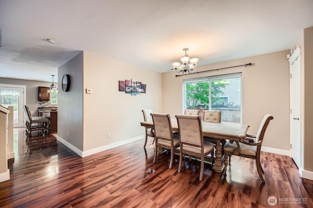 19702 99th Ct E, Bonney Lake, WA 98391 - dining room with a chandelier, wood finished floors, and baseboards