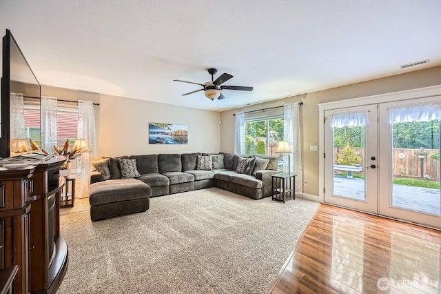 19702 99th Ct E, Bonney Lake, WA 98391 - living area featuring wood finished floors, a ceiling fan, and french doors