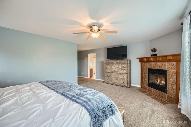 19702 99th Ct E, Bonney Lake, WA 98391 - bedroom with carpet floors, a tile fireplace, a ceiling fan, and baseboards