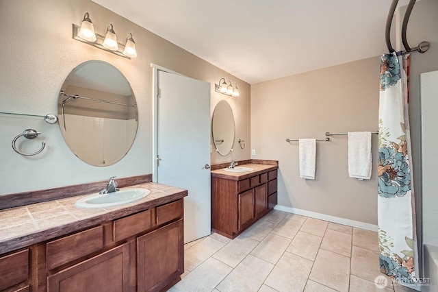 19702 99th Ct E, Bonney Lake, WA 98391 - bathroom featuring two vanities and tile patterned floors