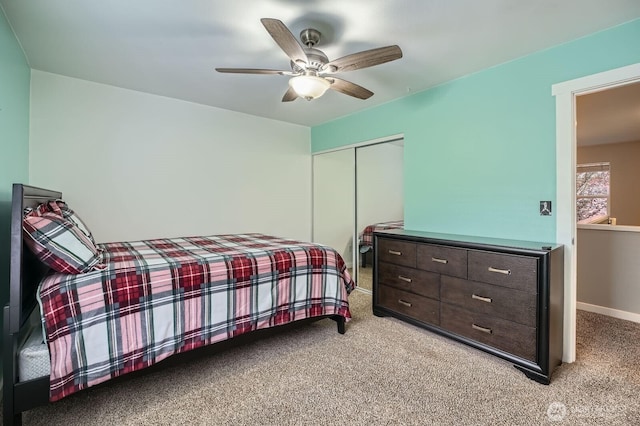 19702 99th Ct E, Bonney Lake, WA 98391 - bedroom featuring light carpet, a closet, ceiling fan, and baseboards