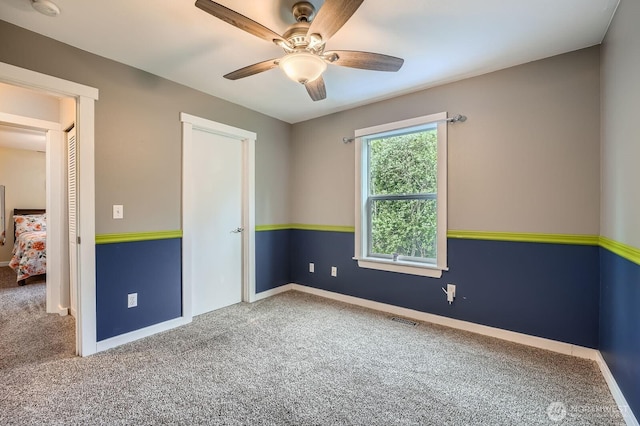 19702 99th Ct E, Bonney Lake, WA 98391 - carpeted spare room with ceiling fan, baseboards, and a smoke detector
