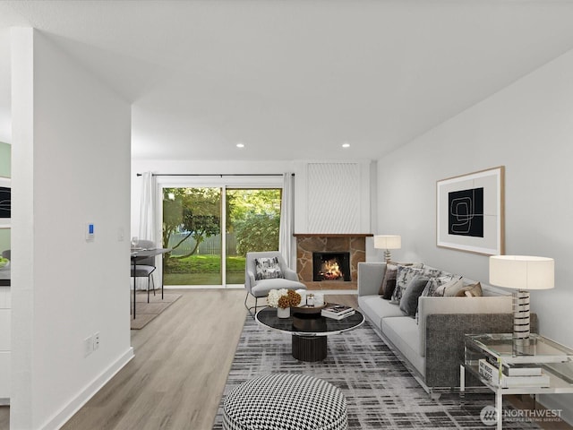 12513 NE 130th Way Unit C102, Kirkland, WA 98034 - living area featuring wood finished floors, a fireplace, recessed lighting, and baseboards