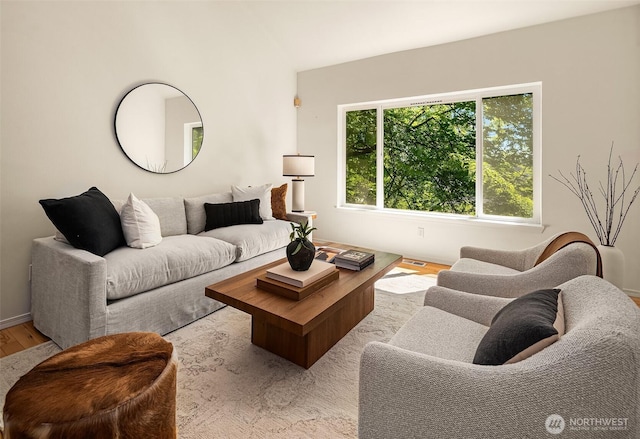 living room with wood finished floors and baseboards