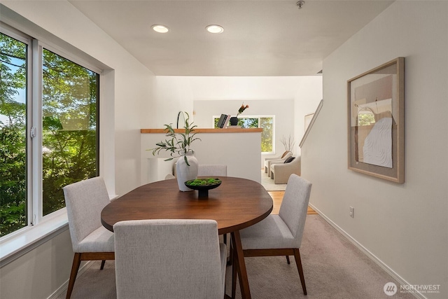 dining space with baseboards, recessed lighting, and carpet flooring
