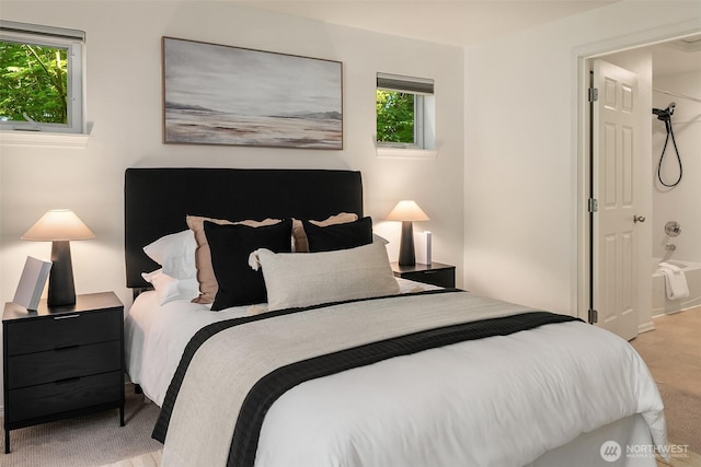 carpeted bedroom featuring multiple windows