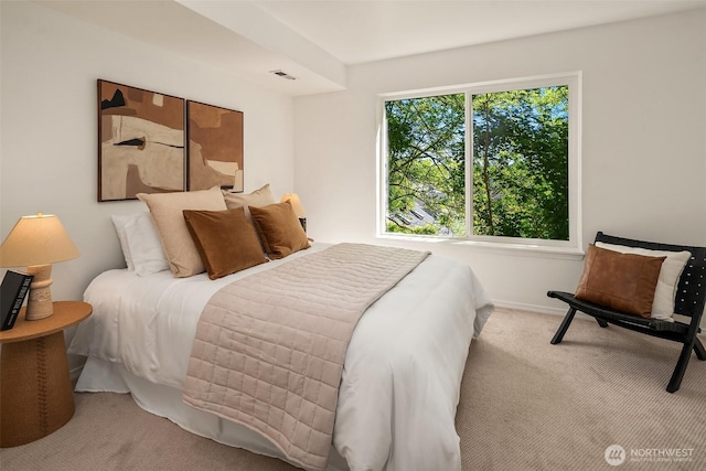 carpeted bedroom featuring baseboards