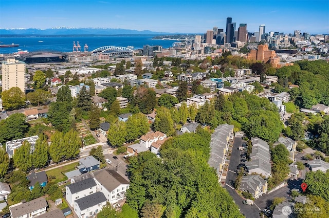 aerial view of property's location with a nearby body of water
