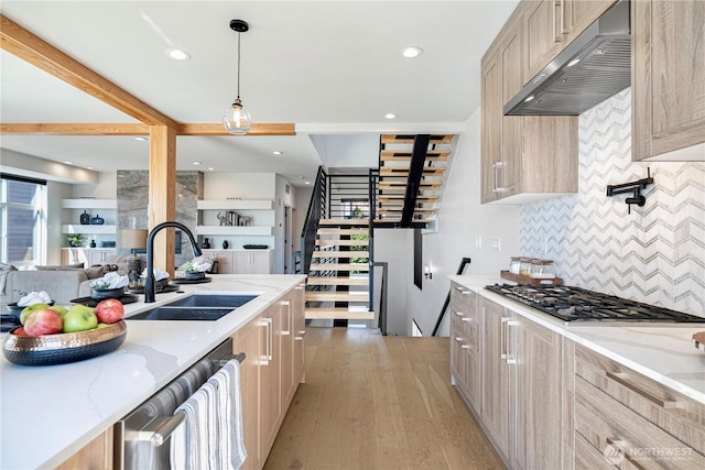 kitchen with extractor fan, stainless steel appliances, light brown cabinetry, tasteful backsplash, and recessed lighting