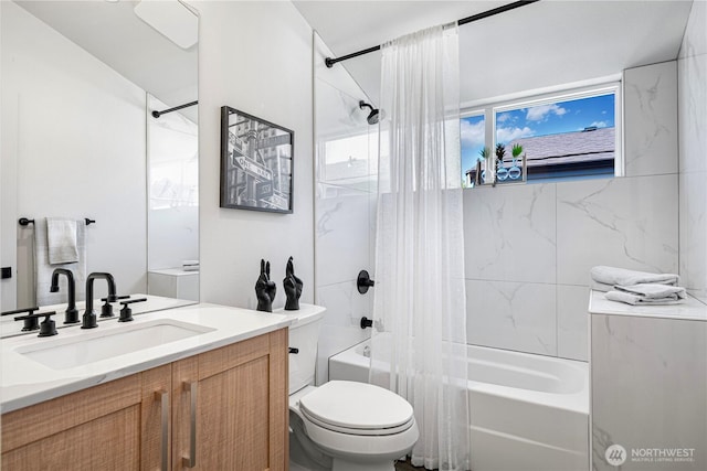 full bath with shower / bath combo, toilet, and vanity