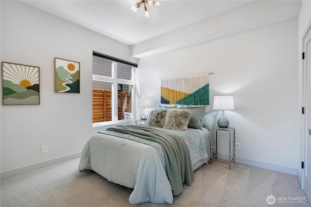 carpeted bedroom with baseboards