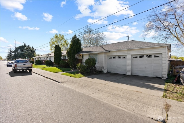 620 E Euclid Ave, Spokane, WA 99207 - ranch-style house with concrete driveway and a garage